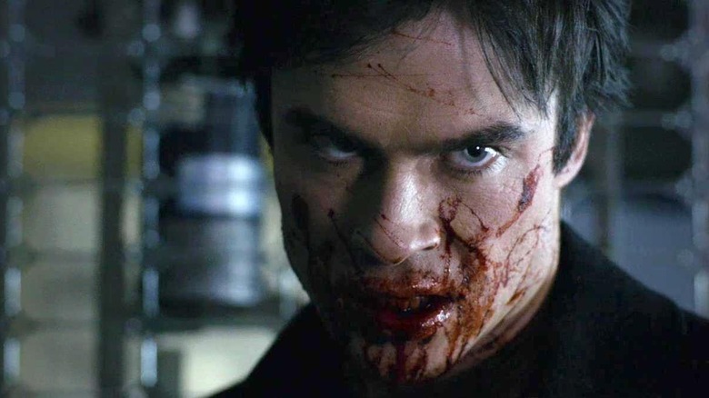 Damon's face covered in blood