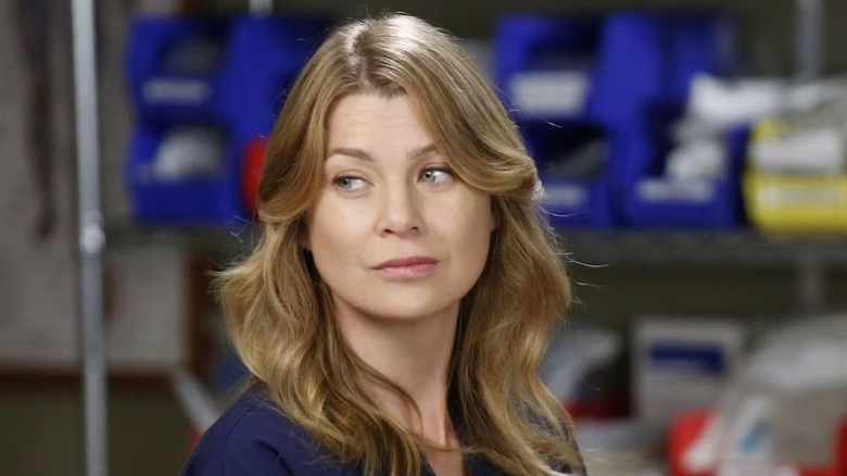 Meredith looking over her shoulder smirking on Grey's Anatomy