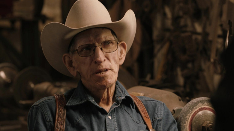 Billy Klapper looking stern while wearing a white cowboy hat