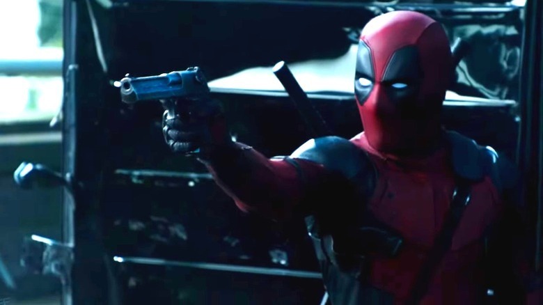 Deadpool aiming a gun