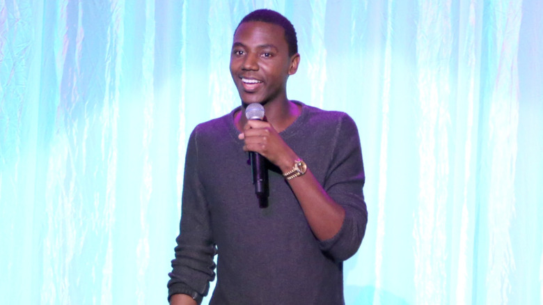 Jerrod Carmichael red hat microphone