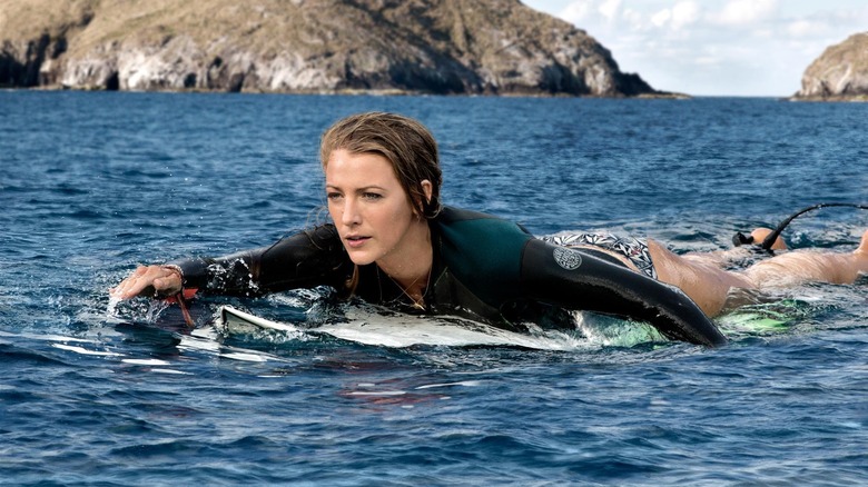 Nancy paddling on surfboard