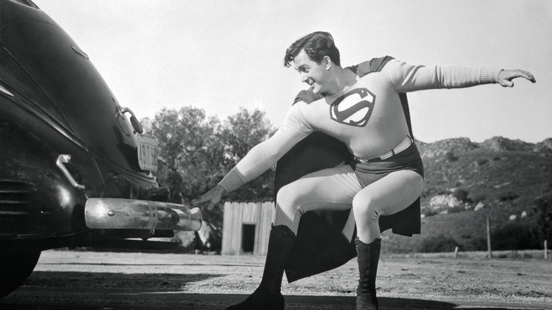 Superman pulls a car