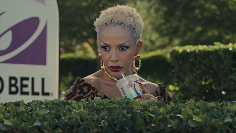 Doja Cat hiding in the bushes in 2025 Taco Bell Super Bowl commercial