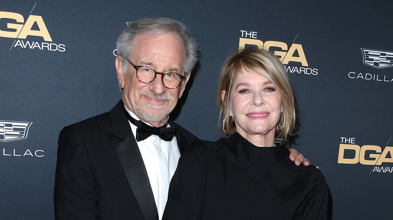 Spielberg and Capshaw stand on the red carpet at the DGA Awards