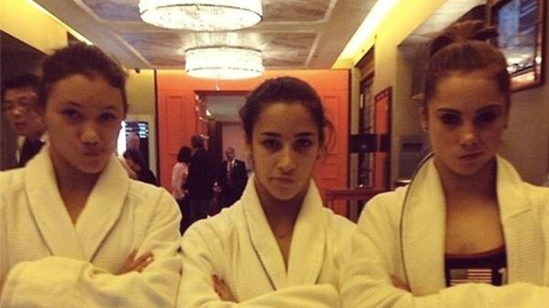 Maroney with Aly Raisman and Kyla Ross outside the pool