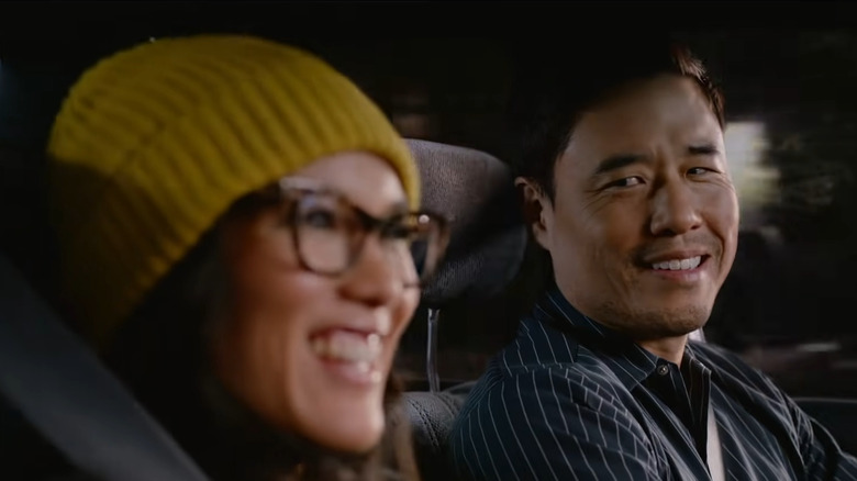 Marcus lovingly looking at Sasha while driving