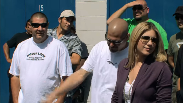 Cast of Storage Wars at an auction