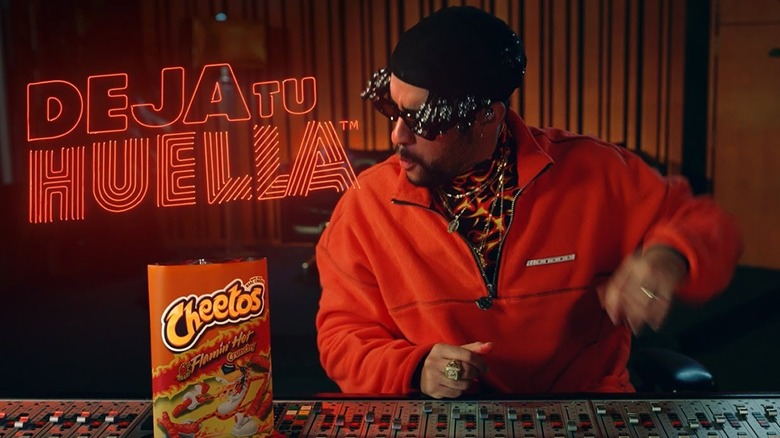 Bad Bunny next to Flamin' Hot Cheetos