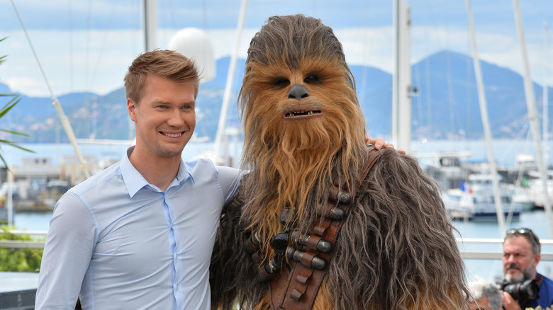 Joonas Suotamo standing next to Chewbacca