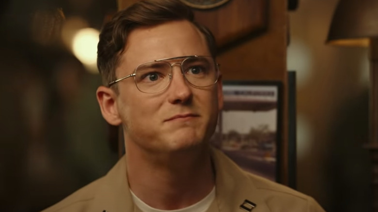 Lewis Pullman smiling with glasses