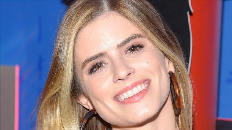 Carlson Young smiling