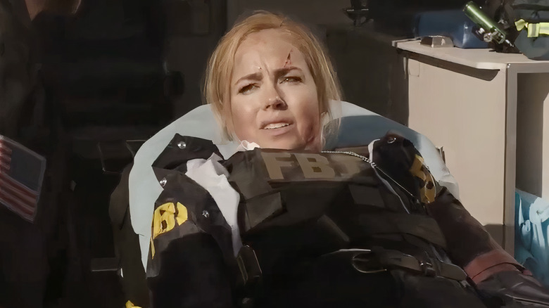 Agent Rose Casey laying on stretcher