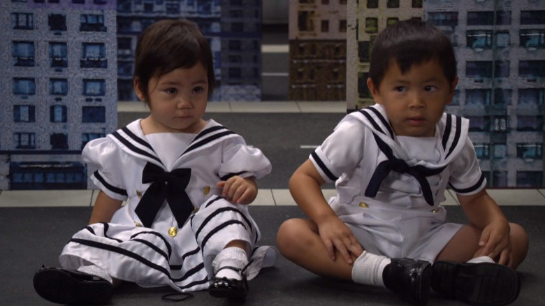 Lily and another child in sailor's outfits