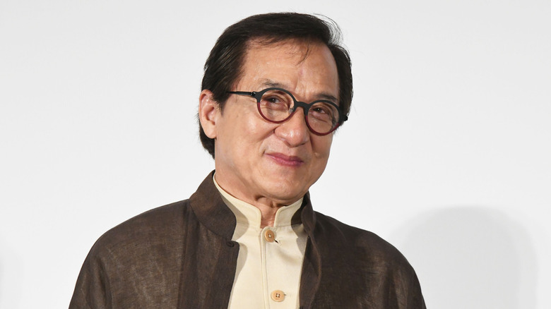 Jackie Chan wearing glasses