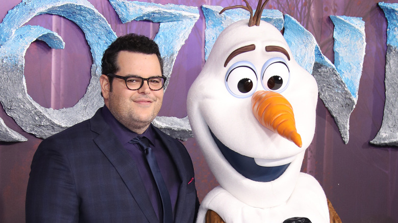 Josh Gad standing beside Olaf