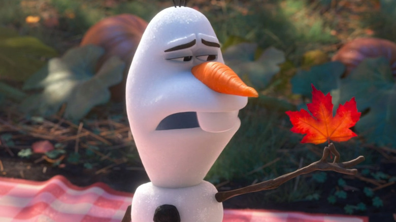 Olaf holding a fallen leaf