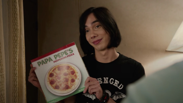 Rodrick Heffley holding a pizza