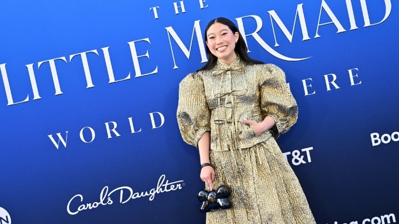 Awkwafina smiling for cameras