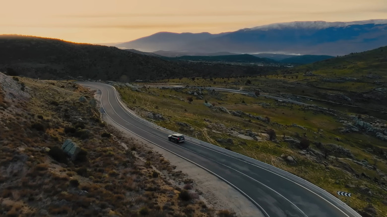 Volvo driving on country road