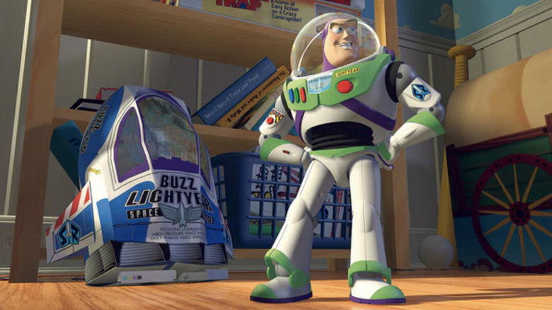 Buzz Lightyear stands beside his packaging