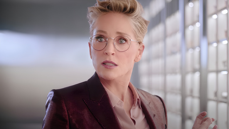 Sharon Stone looking ahead in glasses