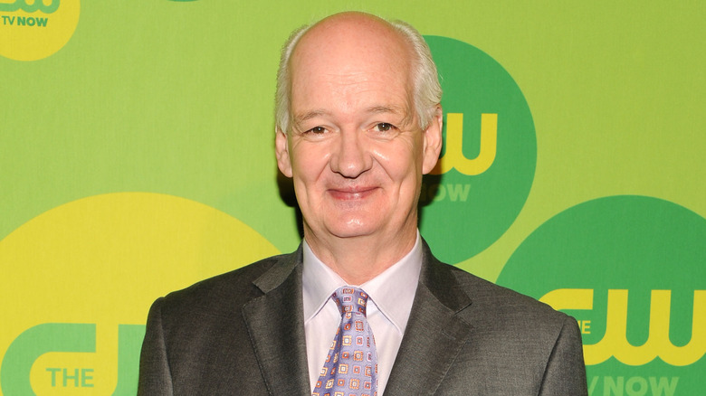 Colin Mochrie smiling at camera