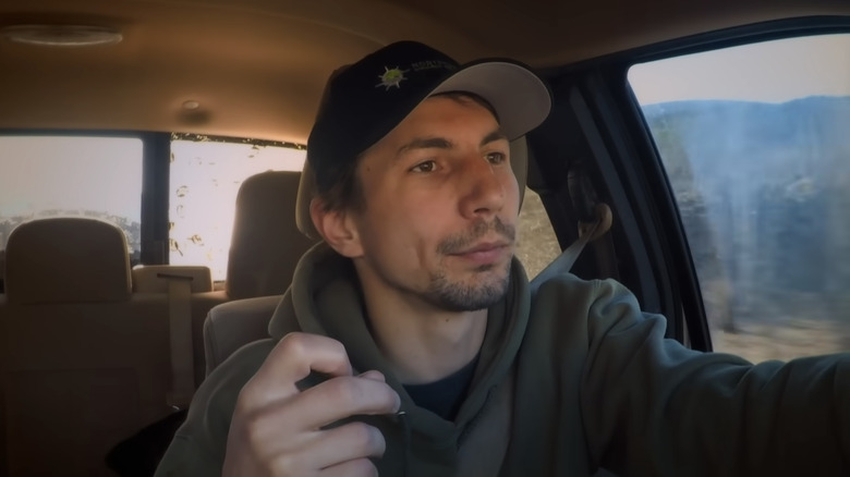 Parker Schnabel sits in car with hat