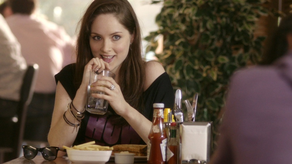 Sophie Rundle drinks from a straw on Episodes