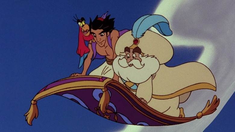 Iago, Aladdin, and the Sultan flying on the magic carpet