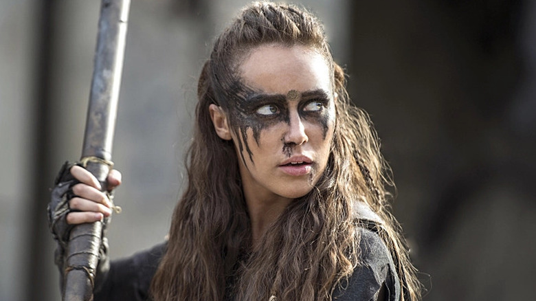 Lexa brandishing her weapon