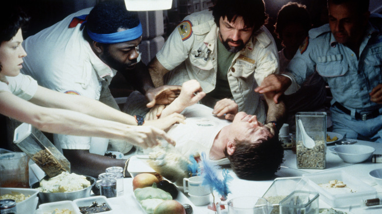 The Nostromo crew tries to help Kane