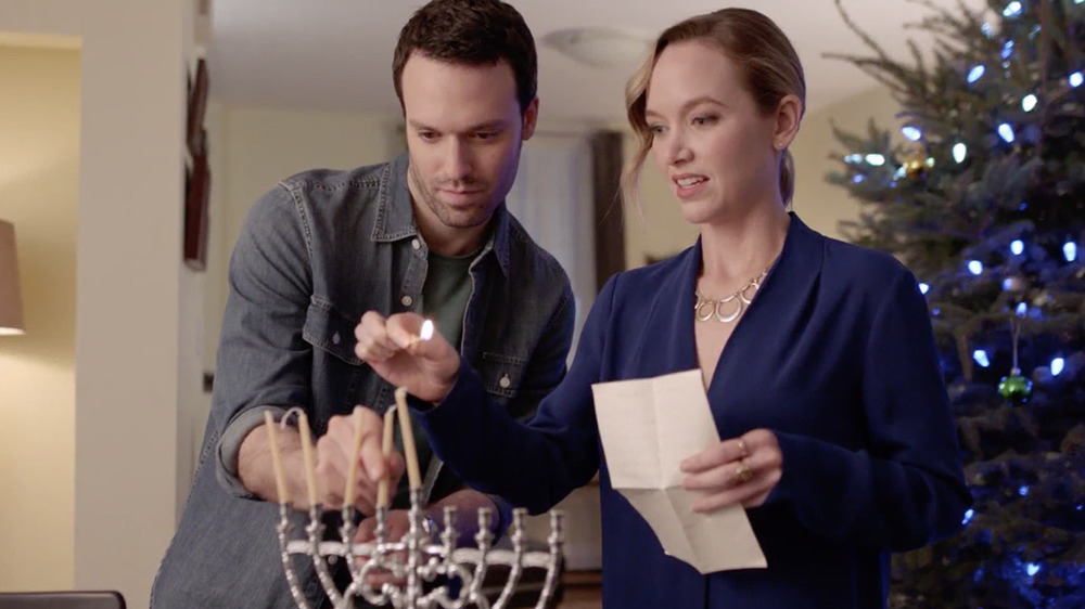 Jake Epstein Lighting a Menorah