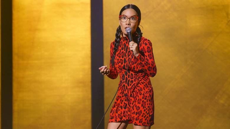 Ali Wong doing stand-up on stage