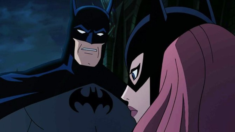 Batman and Batgirl at night