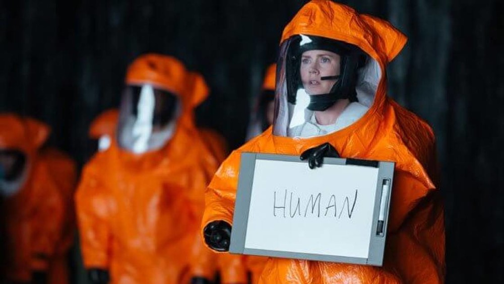 Amy Adams as Louise Banks, attempting to communicate with the aliens in Arrival