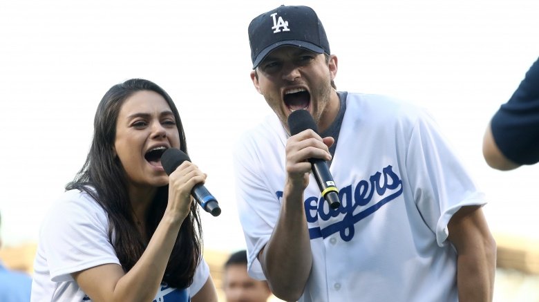 Ashton Kutcher and Mila Kunis at game