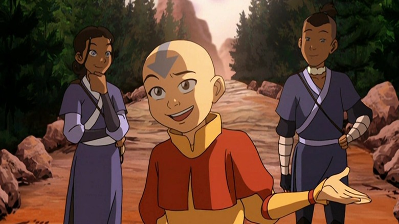 Aang flanked by Katara and Sokka