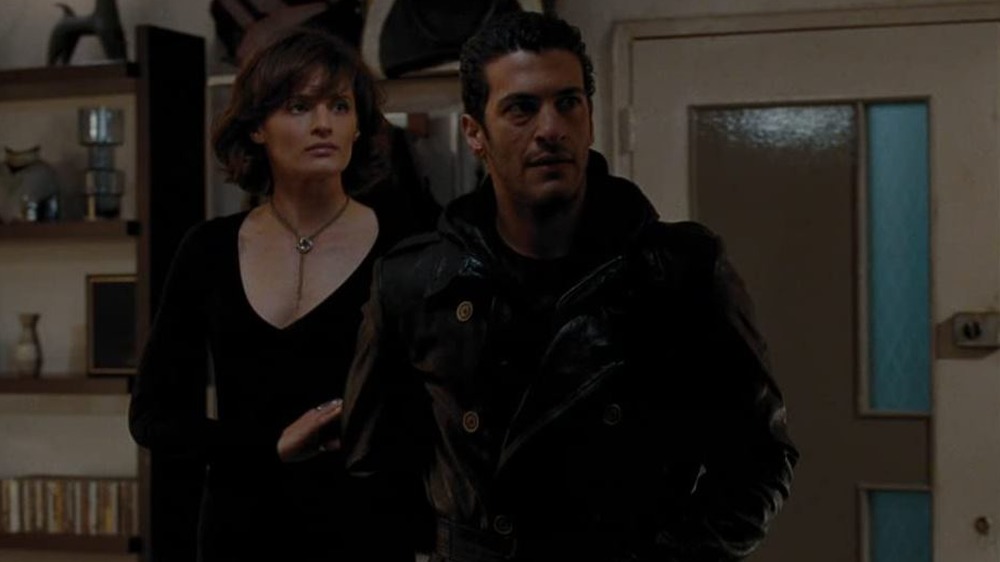 Stana Katic and Simon Kassianides as Corinne Veneau and Yusef Kabira in Quantum of Solace