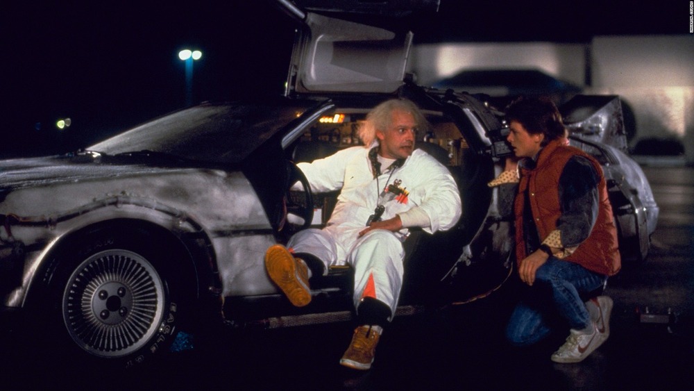 Michael J. Fox as Marty McFly and Christopher Lloyd in the  DeLorean in Back to the Future