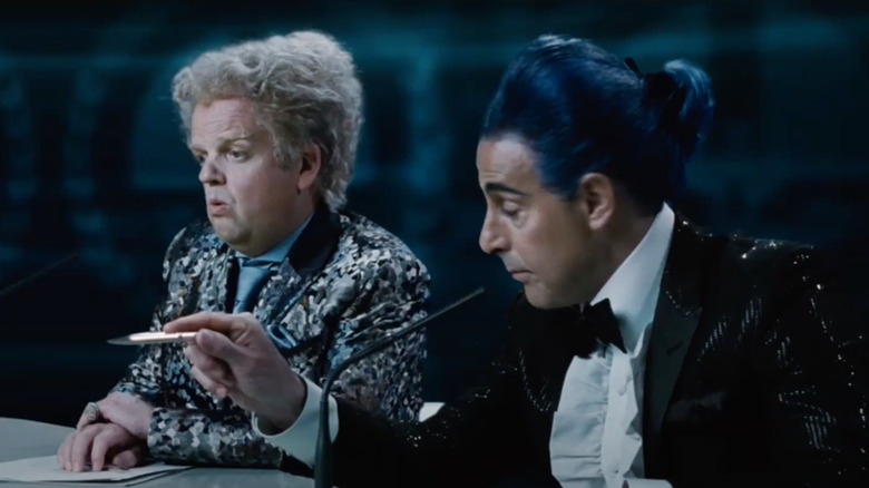 Claudius Templesmith and Caesar Flickerman sitting together