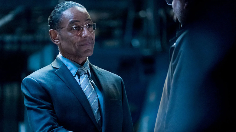 Gus Fring shakes hands with someone