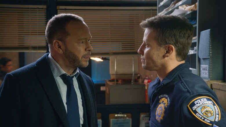 Detective Danny Reagan and a police officer having a conversation