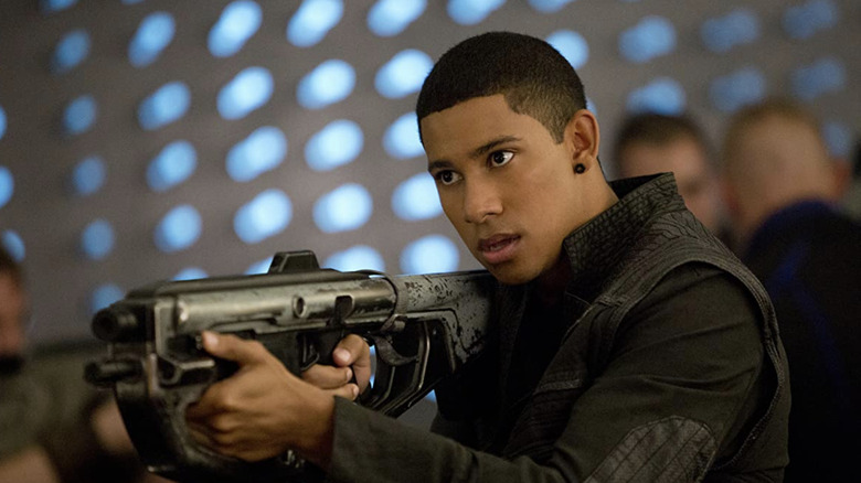 Keiynan Lonsdale holding a gun