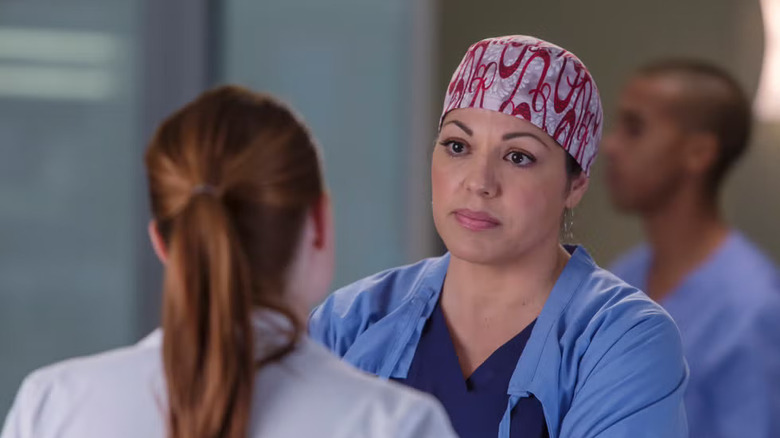 Callie Torres in a scrub cap frowning on Grey's Anatomy