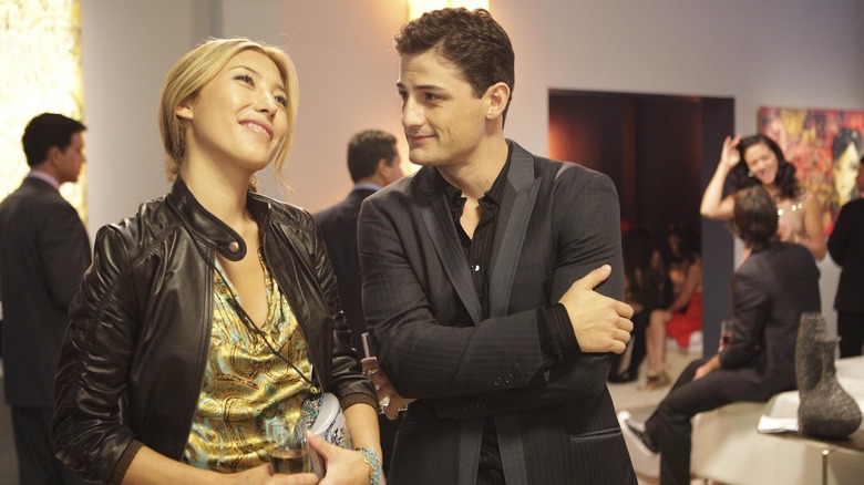 Enver Gjokaj looking at Dichen Lachman