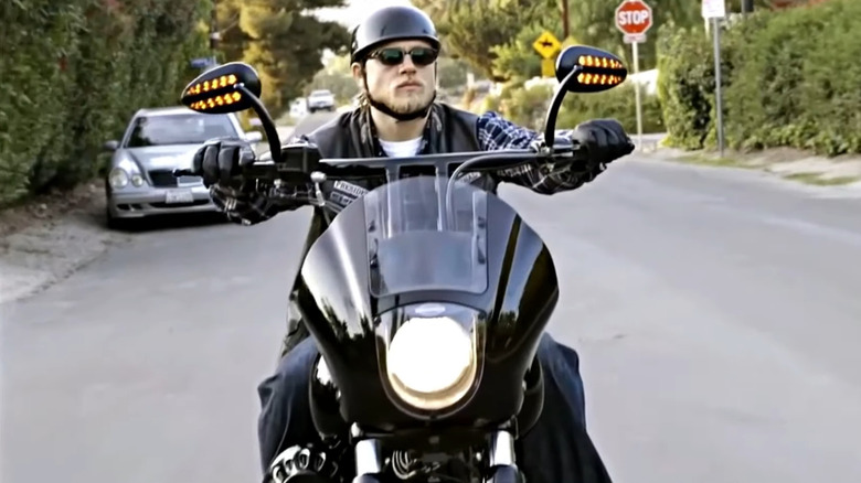 Charlie Hunnam riding motorcycle