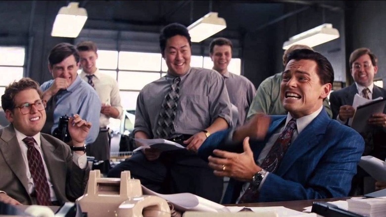 Chester Ming and Jordan Belfort laughing in The Wolf of Wall Street