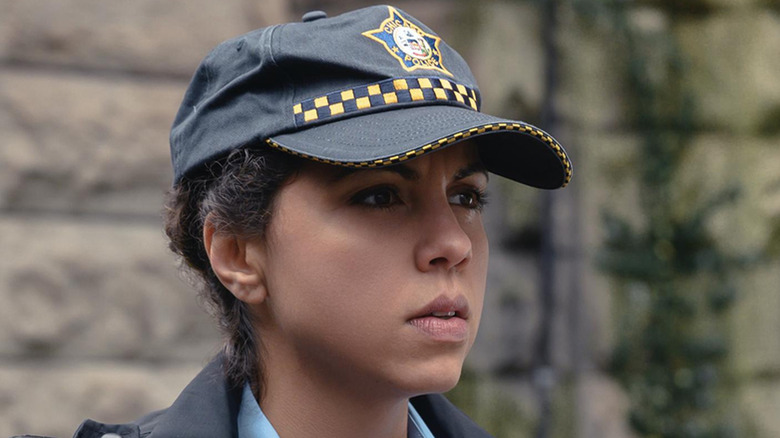 Officer Isabel wearing Chicago police hat 