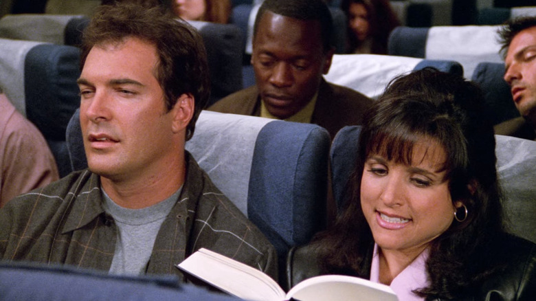 Puddy and Elaine on a plane